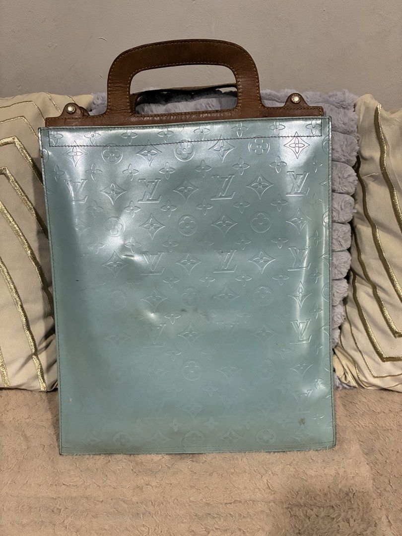 Louis Vuitton Monogram Vernis Stanton Tote bag (Category: Luxury Bags & Wallets) located in Manila. Submitted by cellymeji060371 (Listing ID 1424738906, Image 1). Description: Authentic Louis Vuitton Vernis tote bag in a light blue color. Features a brown leather handle and gold-tone hardware. The bag has the signature LV monogram pattern embossed on the exterior. Includes a lock and key. Made in France. Flaws: Date code not visible anymore maybe