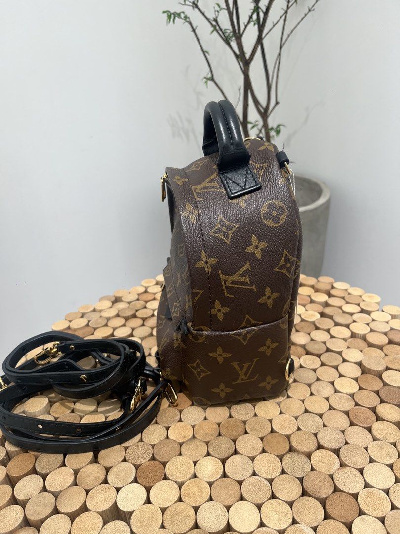 Louis Vuitton Palm Springs Mini Backpack (Category: Luxury Bags & Wallets) located in Taguig. Submitted by raraofpursemaison (Listing ID 1424756366, Image 2). Description: Condition: Very Good (8.5/10) Exterior: Minor lint on strap loops, minor marks on canvas, minor cracks on the straps and minor scuffs on the leather. Interior: Minor scuffs on the leather, mild marks/stain and mild signs of usage. Hardware: Hairline scratches. Inclusions: Box, 