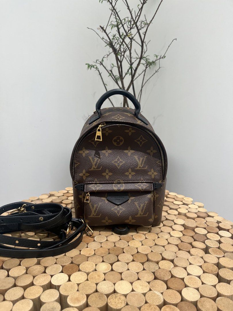 Louis Vuitton Palm Springs Mini Backpack (Category: Luxury Bags & Wallets) located in Taguig. Submitted by raraofpursemaison (Listing ID 1424756366, Image 1). Description: Condition: Very Good (8.5/10) Exterior: Minor lint on strap loops, minor marks on canvas, minor cracks on the straps and minor scuffs on the leather. Interior: Minor scuffs on the leather, mild marks/stain and mild signs of usage. Hardware: Hairline scratches. Inclusions: Box, 