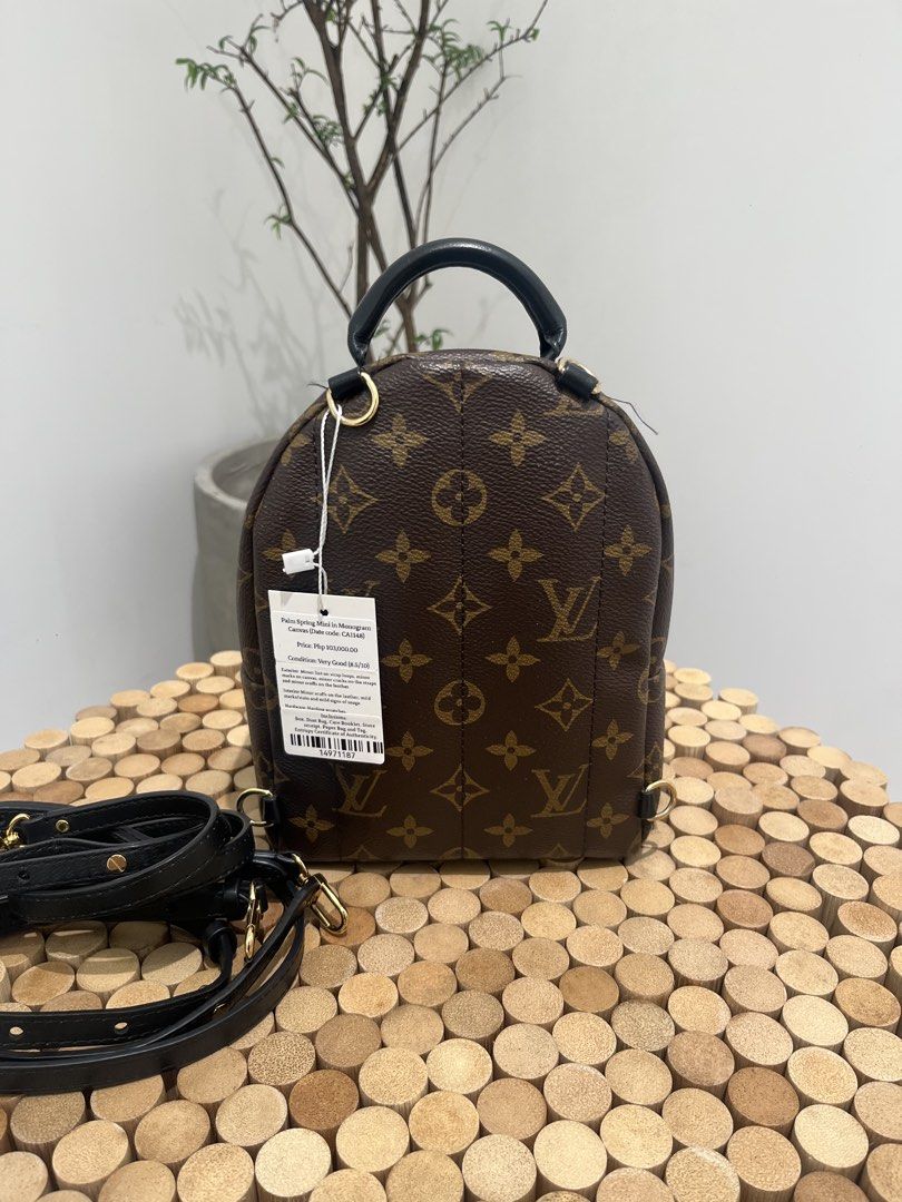 Louis Vuitton Palm Springs Mini Backpack (Category: Luxury Bags & Wallets) located in Taguig. Submitted by raraofpursemaison (Listing ID 1424756366, Image 3). Description: Condition: Very Good (8.5/10) Exterior: Minor lint on strap loops, minor marks on canvas, minor cracks on the straps and minor scuffs on the leather. Interior: Minor scuffs on the leather, mild marks/stain and mild signs of usage. Hardware: Hairline scratches. Inclusions: Box, 