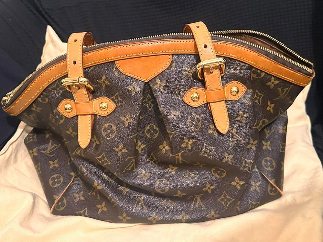 Original Louis Vuitton LV Tivoli Monogram Bag. Authentic. (Category: Luxury Bags & Wallets) located in Quezon City. Submitted by fastfire_6030c1 (Listing ID 1424718335, Image 2). Description: Vintage, Authentic Louis Vuitton Bag. Comes with its original dustbag. Large luxury bag. Original / authentic item. Tablet and laptop can fit in this bag. Please send a message if you want more pics of the bag..
