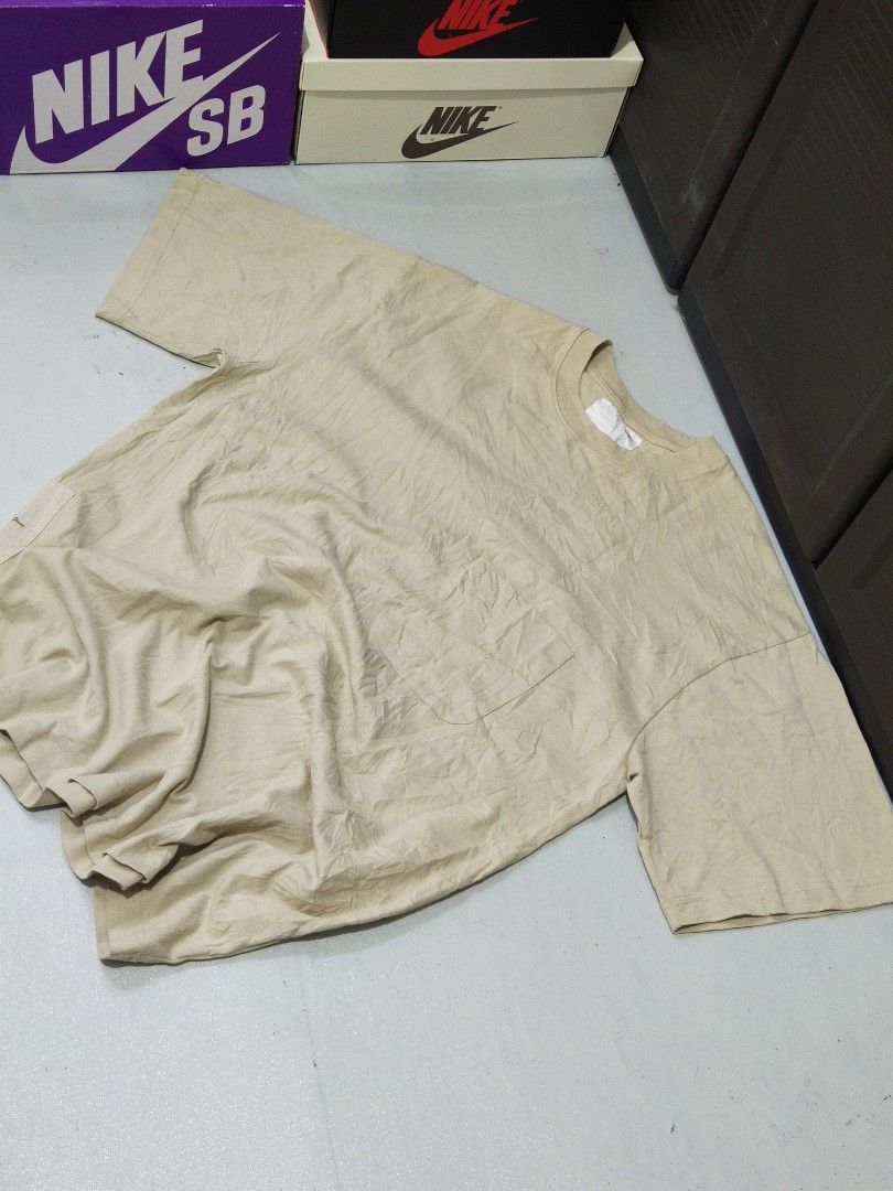 Madness Pocket Tee (Category: Tshirts & Polo Shirts ) located in Manila. Submitted by djs777 (Listing ID 1424792439, Image 1). Description: - Madness pocket tee in beige - Features a unique graphic on the chest pocket - Made from 100% cotton - Relaxed fit - Includes care label with washing instructions.