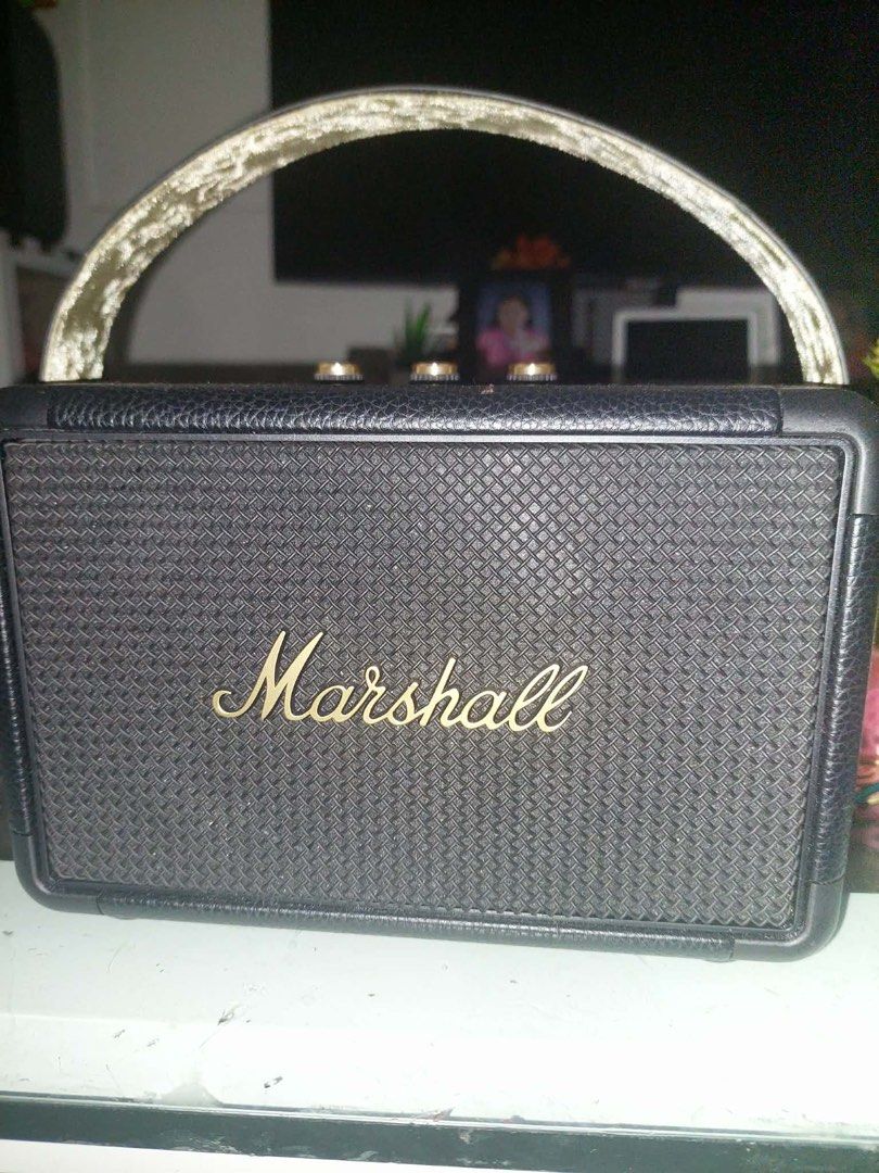 Marshall Killburn II (2) (Category: Soundbars, Speakers & Amplifiers) located in Quezon City. Submitted by loveeedbyrl (Listing ID 1424827942, Image 2). Description: Black Marshall Killburn II portable Bluetooth speaker with a handle. It has gold-colored control knobs on top and the Marshall logo on the front. It is suitable for listening to music at home or on the go. Still nego & lightly used onlyy :) .