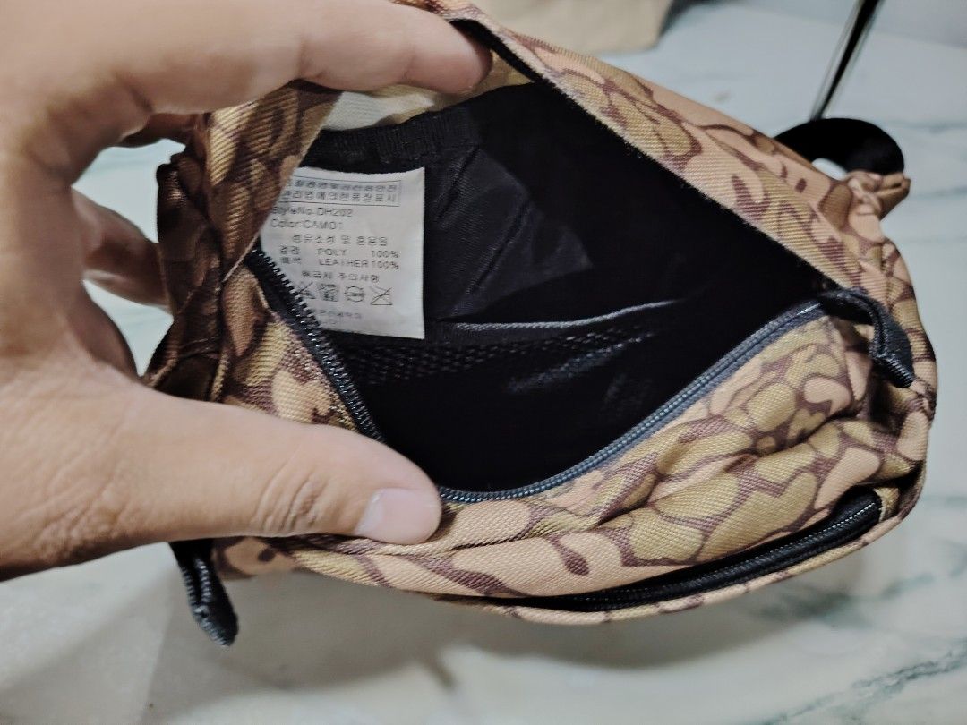 Mens belt bag (Category: Belt bags, Clutches and Pouches) located in Manila. Submitted by drxx.drip_19 (Listing ID 1424818476, Image 2). Description: - Preloved men's belt bag - Unique camo design - Stylish and practical - Perfect for everyday use.