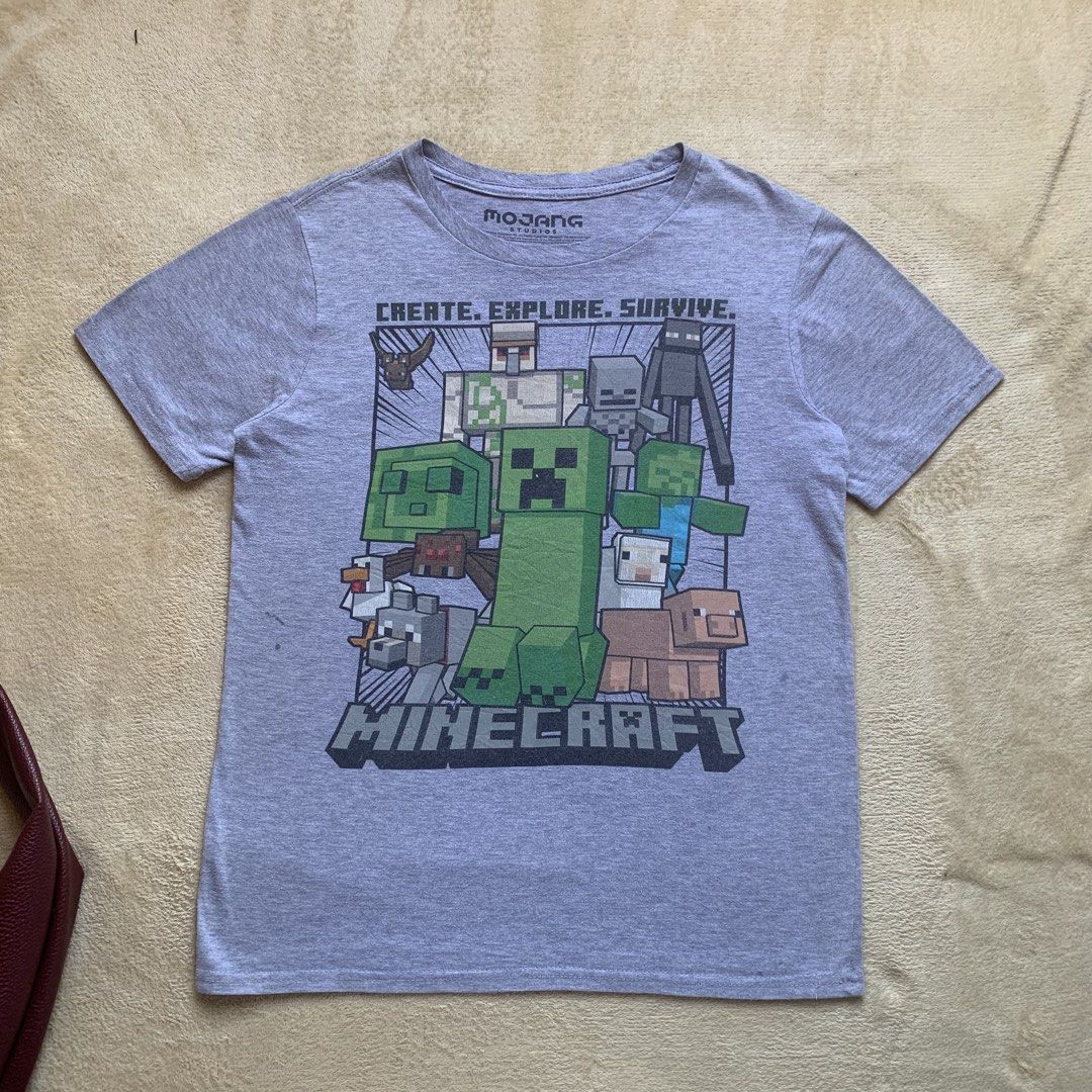 Mojang Minecraft tee (Category: Tshirts & Polo Shirts ) located in Guagua. Submitted by thethrift.verse.exe (Listing ID 1424765079, Image 1). Description: Length: 24 Width: 17 washable stain, minimal hairlines color rate: 10/10 condition: 9/10.