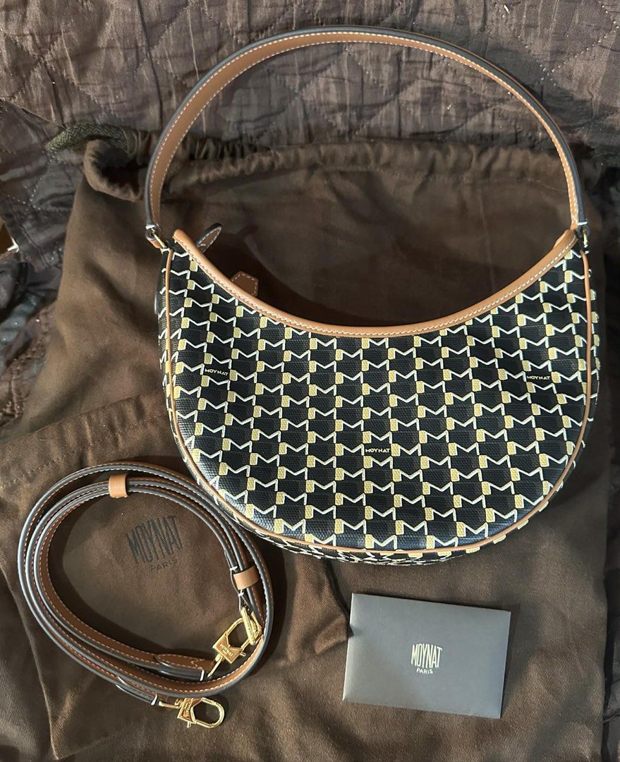 Moynat Paris Mini Réjane Bag (Category: Luxury Bags & Wallets) located in Manila. Submitted by keithhh16 (Listing ID 1424785302, Image 1). Description: - Moynat Paris Mini Réjane bag - Color: Black and Gold - Features: - Detachable shoulder strap - Top handle - Unique pattern - Brown leather trim - Includes: Dust bag and card .