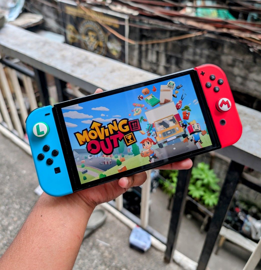Nintendo Switch Oled with Free Games (Category: Nintendo) located in Manila. Submitted by nswitchgear (Listing ID 1424851721, Image 2). Description: For Sale Only 🥂 Nintendo Switch OLED RedBlue 10,999 FREE acess to my Paid games Legit purchase not Jailbreak. Used item but in Good/Best condition Can give 7 Days personal Warranty for peace of mind. Comes w/ Box and complete accessories (dock,charger,hdmi,grips,straps) FREE pouch and tempered glass