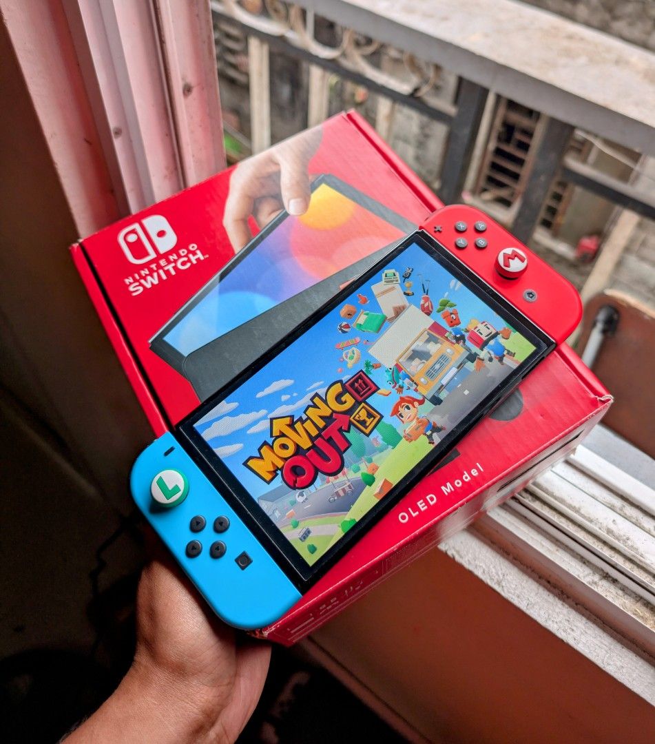 Nintendo Switch Oled with Free Games (Category: Nintendo) located in Manila. Submitted by nswitchgear (Listing ID 1424851721, Image 1). Description: For Sale Only 🥂 Nintendo Switch OLED RedBlue 10,999 FREE acess to my Paid games Legit purchase not Jailbreak. Used item but in Good/Best condition Can give 7 Days personal Warranty for peace of mind. Comes w/ Box and complete accessories (dock,charger,hdmi,grips,straps) FREE pouch and tempered glass