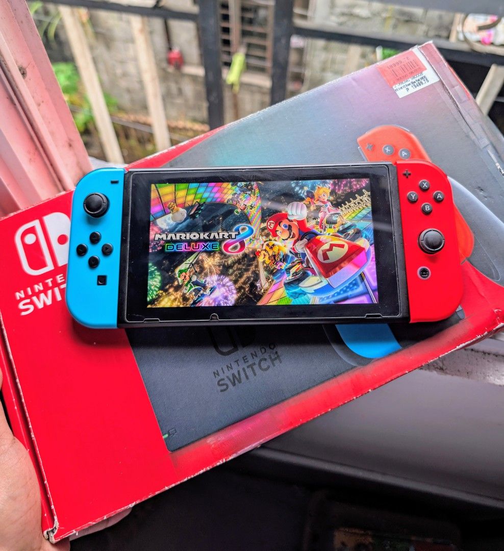 Nintendo Switch V2 with Free Games (Category: Nintendo) located in Manila. Submitted by nswitchgear (Listing ID 1424857245, Image 1). Description: Nintendo Switch V2 with Free Games ₱8,499 FREE acess to my Paid games Legit purchase not Jailbreak. Used item but in Good/Best condition Can give 7 Days personal Warranty for peace of mind. -Doon po tayo sa kaya tayong issupport, dont settle for less. Comes w/ Complete accessories and pouch (Charger,do