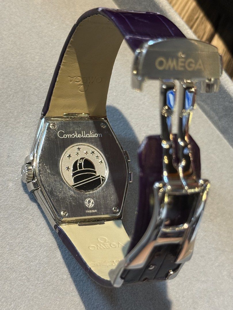 Omega Constellation Diamond Watch (Category: Luxury Watches) located in Manila. Submitted by ahmazing (Listing ID 1424798036, Image 2). Description: - Omega Constellation watch - Dark dial with diamond hour markers - Stainless steel case - Purple leather strap/Supernova - Date display at 3 o'clock - Constellation logo on the back - Deployment clasp with Omega logo - Ref. No.: 123.13.35.60.60.001 - Box and Receipt - Country of Purchase: 🇯🇵.