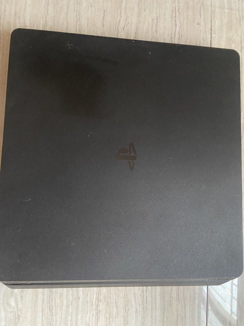 PlayStation 4 Slim 1tb (Category: PlayStation) located in Caloocan City. Submitted by ss_kai (Listing ID 1424741031, Image 1). Description: Includes a PlayStation 4 console, two black controllers, and one white controller. Also comes with a charging dock for the controllers. The bundle includes five games: Crash Bandicoot N. Sane Trilogy, Tekken 7, God of War, Detroit: Become Human, and The Last of Us Remastered. Comes with the original box of th