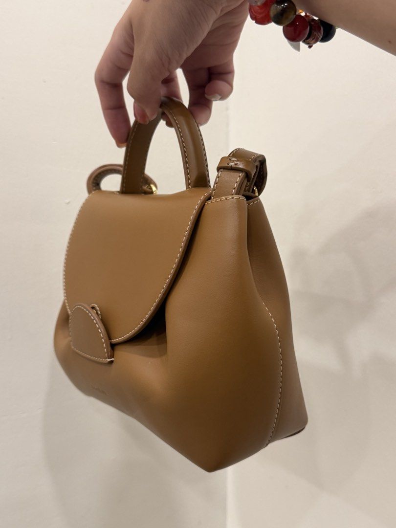 POLENE (Category: Luxury Bags & Wallets) located in Taguig. Submitted by que_08 (Listing ID 1424708519, Image 3). Description: POLENE NUMERO NANO brown leather with dustbag used few times with minimal signs of wear guaranteed original price: 20,000 Location: BGC or Santa rosa Laguna Ships and meetup Gcash or cod thank you.