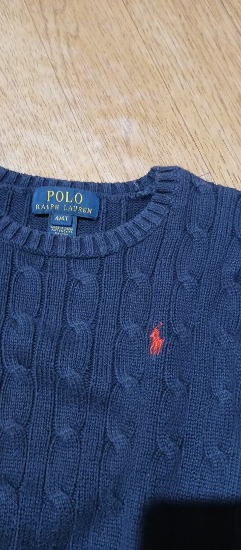 Polo Ralph Lauren Cable Knit Sweater 4T (Category: Babies & Kids Fashion) located in Quezon City. Submitted by mangthrift (Listing ID 1424856870, Image 2). Description: - Polo Ralph Lauren sweater - Dimes 13/16 (kids) - Color: Navy blue - Size: 4T - Design: Cable knit - Features the Polo Ralph Lauren logo - Neckline: Crew neck - Sleeves: Long - Material: Soft knit, ideal for cooler weather.