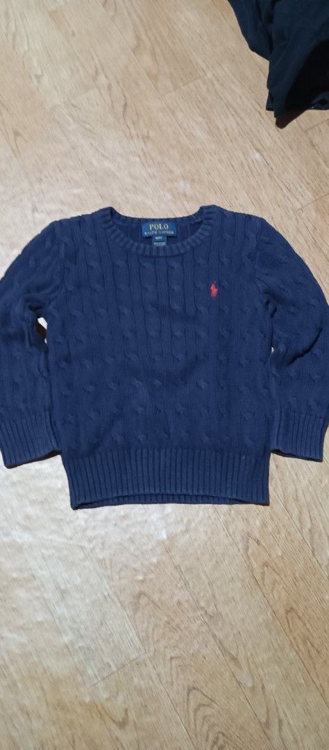 Polo Ralph Lauren Cable Knit Sweater 4T (Category: Babies & Kids Fashion) located in Quezon City. Submitted by mangthrift (Listing ID 1424856870, Image 1). Description: - Polo Ralph Lauren sweater - Dimes 13/16 (kids) - Color: Navy blue - Size: 4T - Design: Cable knit - Features the Polo Ralph Lauren logo - Neckline: Crew neck - Sleeves: Long - Material: Soft knit, ideal for cooler weather.