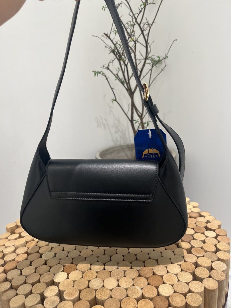 Prada Cleo Logo Plaque Shoulder Bag (Category: Luxury Bags & Wallets) located in Taguig. Submitted by raraofpursemaison (Listing ID 1424752288, Image 3). Description: Condition: Mint (9.3/10) Exterior: Mild marks on the corner, wrinkles on strap and minor press marks. Interior: Mild marks on the leather and mild signs of usage. Hardware: Hairline scratches. Inclusions: Dust Bag, Store Receipt, RFID Card and Care Booklet. Entrupy Certificate of Au