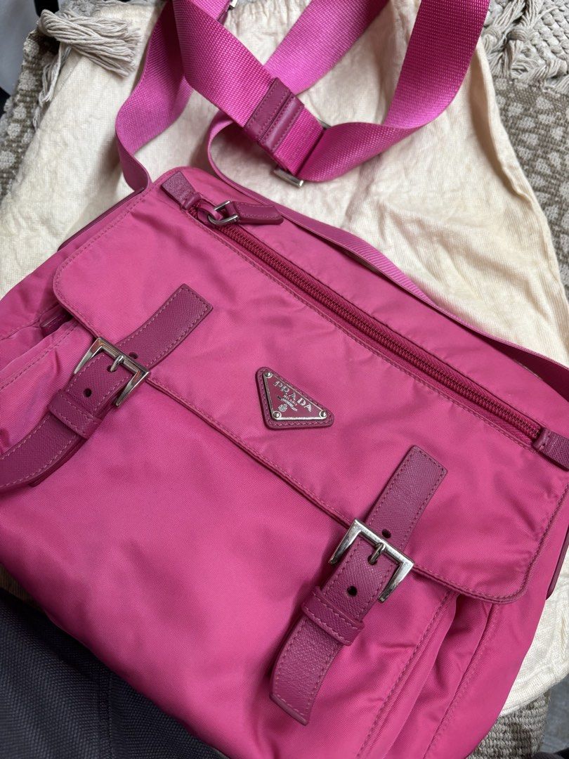 Prada Vela Messenger Bag - Fuxia (Category: Luxury Bags & Wallets) located in Sorsogon. Submitted by thriftychad (Listing ID 1424815990, Image 1). Description: - Authentic Prada Vela Messenger Bag - Color: Fuchsia - Material: Nylon with leather accents - Hardware: Silver-tone - Features: - Detachable shoulder strap - Interior zip pocket - Prada logo plaque - Includes: Authenticity cards and dust bag - Closure: Zip - Strap: Adjustable.