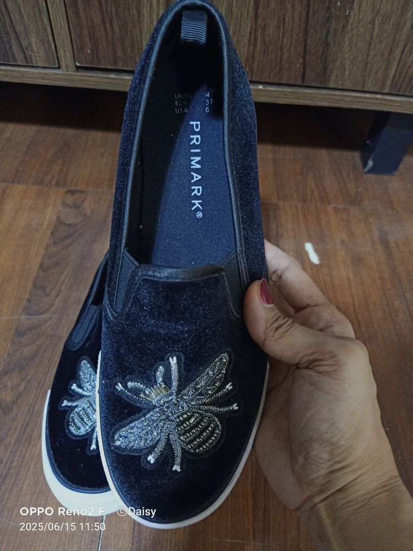 Primark Bee Embellished Slip-on Shoes (Category: Sneakers) located in Quezon City. Submitted by uydaisy1979 (Listing ID 1424758415, Image 2). Description: Black slip-on shoes from Primark. Features a bee embroidery on the front. The shoes have a white sole..
