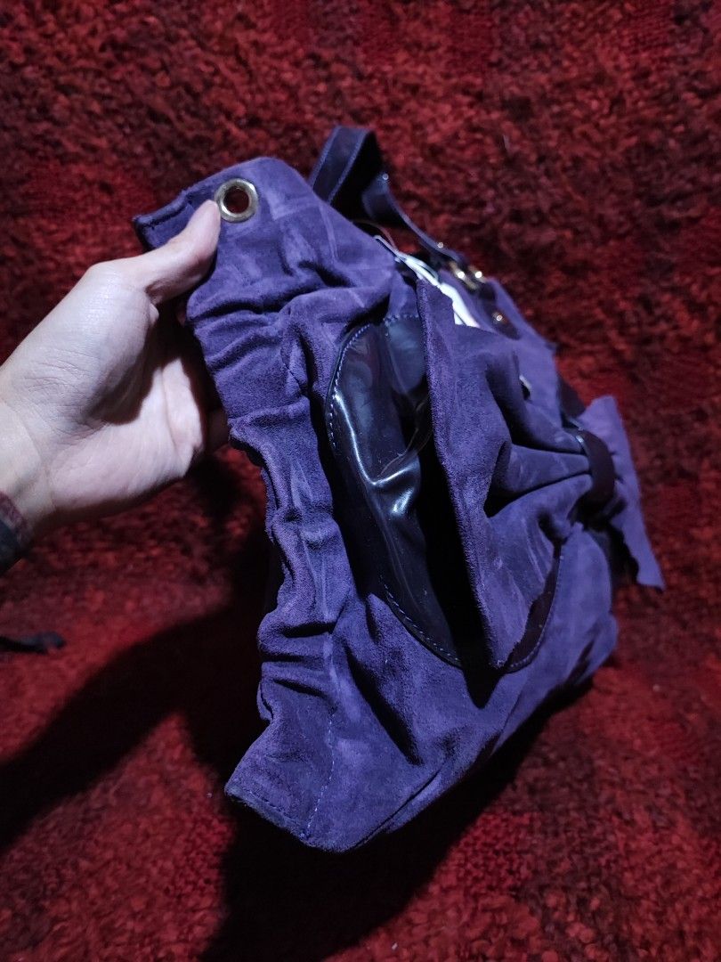 Red Valentino Purple Suede Handbag (Category: Luxury Bags & Wallets) located in Baguio. Submitted by ozara.06 (Listing ID 1424711363, Image 3). Description: Red Valentino Medium size New with tag Suede material Missing sling strap 1300.