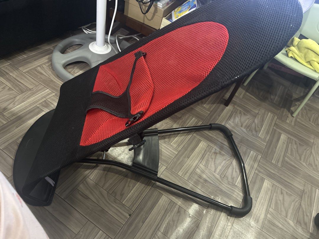 Rocking bouncer (Category: Cots & Cribs) located in Pasay City. Submitted by decluttermomma24 (Listing ID 1424796476, Image 2). Description: - Rocking bouncer - Breathable mesh design - Red and black color scheme - Comfortable for baby.
