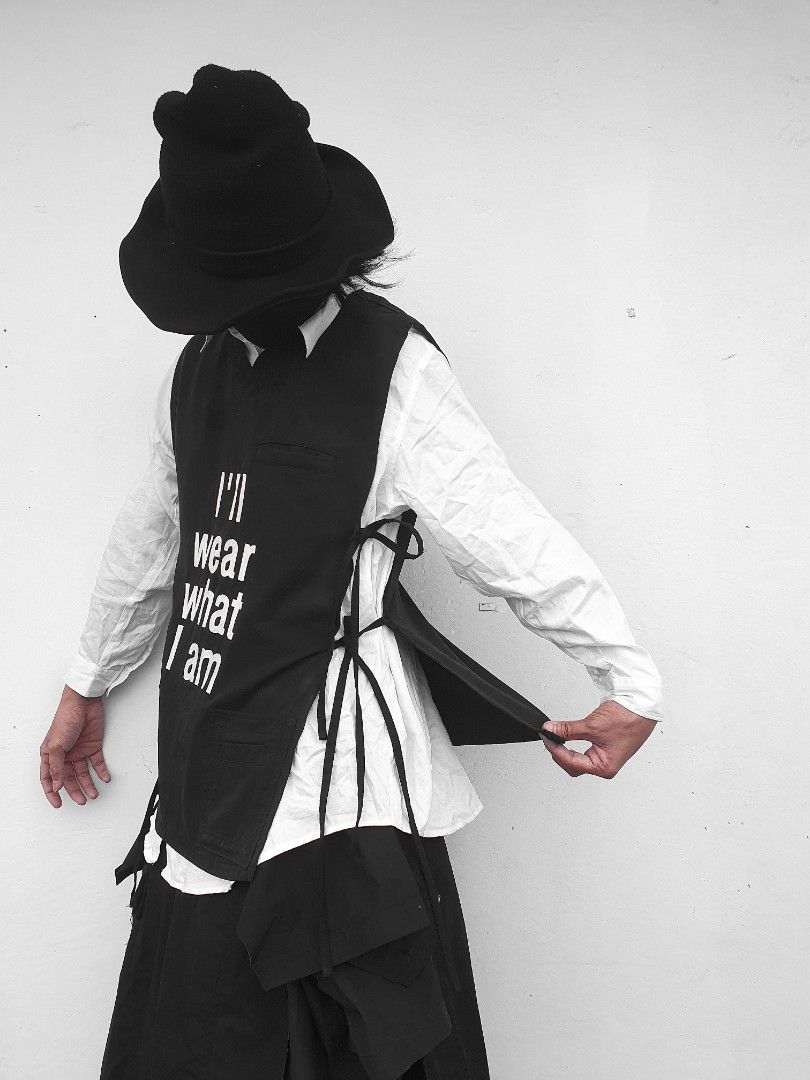 Statement open side vest (Category: Vests) located in Caloocan City. Submitted by wearystudios (Listing ID 1424751692, Image 2). Description: MISFIT "STATEMENT" open side vest with ties in black, made from an old Scrub, one front pocket, attached side pockets from the original sleeve, stencil handpainted 1/1 Freesize Shoulder 17.5 Width 17.5 Length 30.
