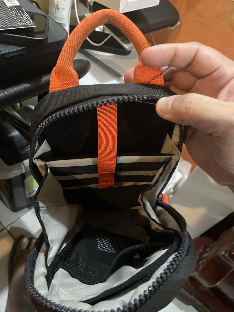 Switch 2 carry package (Category: Cases & Covers) located in Cainta. Submitted by josephfva (Listing ID 1424793277, Image 2). Description: - Switch 2 Carry Package - Includes: - Tomtoc G49 sling bag (black, orange accents) - Iine One-piece magnetic transparent case - JSAux Solit protective case with front cover - Preloved condition.