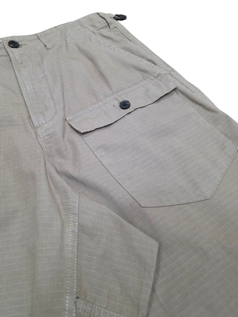 Universal Works Peacenik Pants (Sand heavy ripstop) (Category: Trousers) located in Angeles City. Submitted by recyclecenter (Listing ID 1424831211, Image 2). Description: Universal Works Peacenik Pant (Sand Heavy Ripstop) Size 30 *actual color differs a bit from the photo posted. Sandy light brown color* Inspired by classic Military 'Cargo Pants' with a fresh fit, the 'Peacenik Pant' is a fatigue-style trouser with a panel insert and extra front