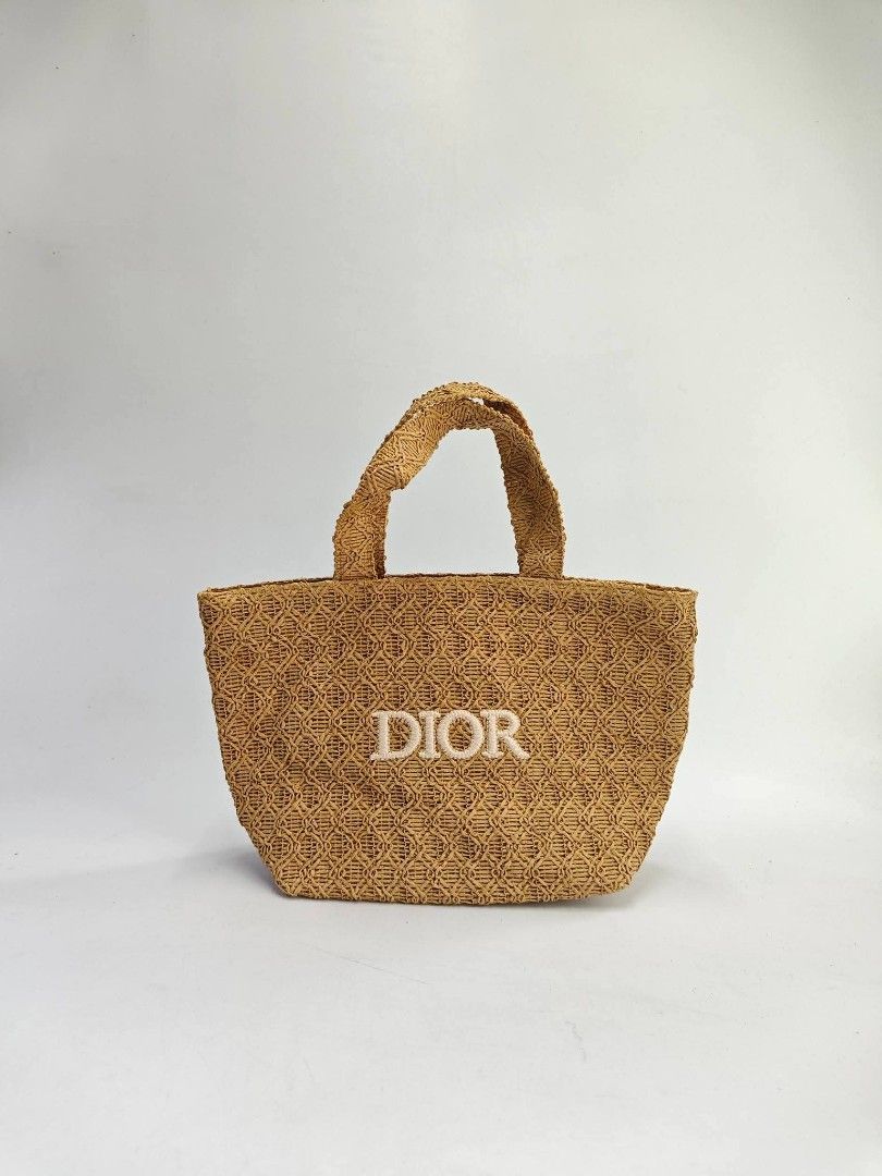 👑VIP Dior Woven Tote Bag mini (Category: Luxury Bags & Wallets) located in Quezon City. Submitted by elegantephbycharlie (Listing ID 1424758318, Image 1). Description: Woven tote bag features the Dior logo embroidered on the front. It has two top handles and a spacious interior. The bag is made of a woven material and has a light brown color. The interior lining is a light pink color. It is a stylish and practical accessory..