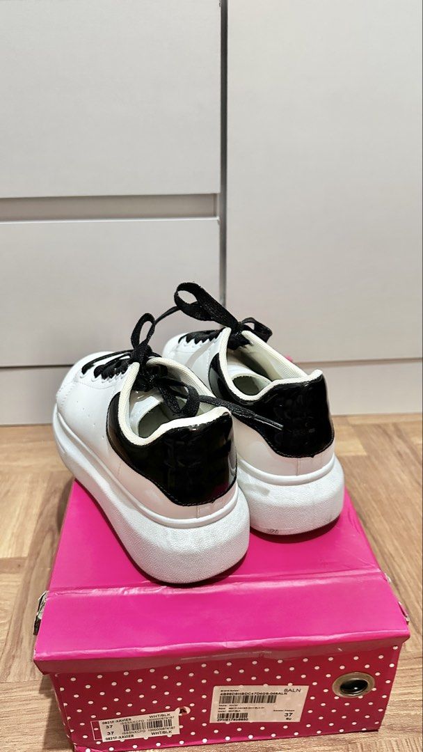 White Sneakers with Black Accents (Category: Sneakers) located in Paranaque City. Submitted by hershey_august (Listing ID 1424818250, Image 3). Description: Stylish white sneakers with black accents. Features black laces and a thick white sole. Size is 37 EU..