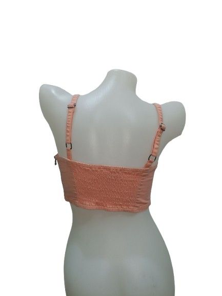 XXI Premium Denim Crop Top (Category: Others Tops) located in Quezon City. Submitted by Think_Like_Chinita (Listing ID 1424773664, Image 2). Description: Crop top features a peach color and adjustable straps. It has a smocked back and a zipper closure. The tag indicates it is a size S. Made in China..