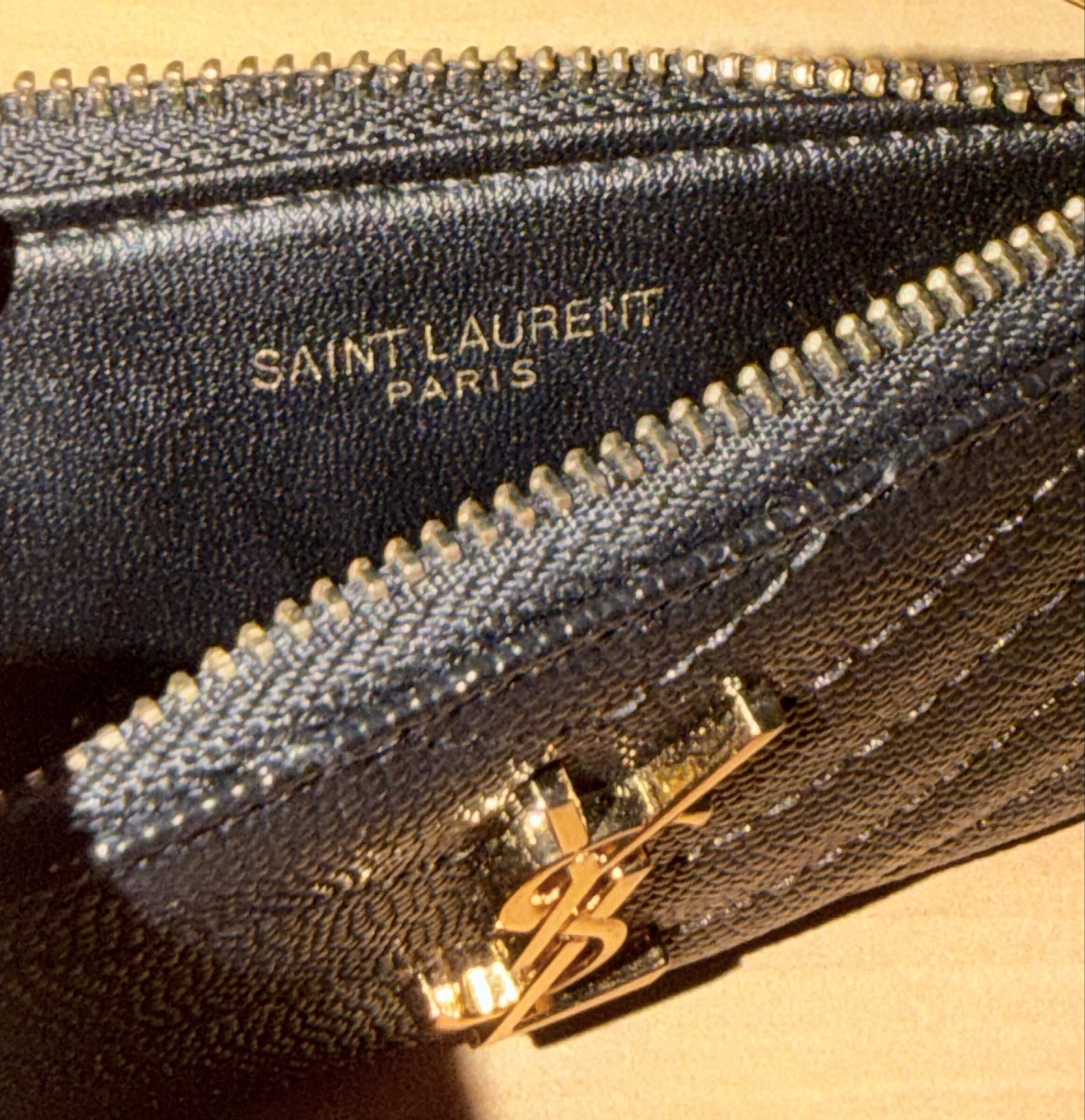 YSL WALLET (Category: Luxury Bags & Wallets) located in Manila. Submitted by heypreloved2016 (Listing ID 1424835201, Image 3). Description: - High Quality YSL Wallet - Classic black color - Features the iconic YSL logo - 5 card slots - Zip closure for security - Includes original packaging - Stylish and practical design.