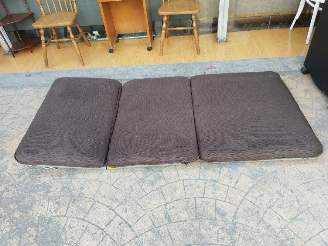 Brown Folding bed/Chair (Category: Chairs) located in Manila. Submitted by ivan_furnitures421 (Listing ID 1424902112, Image 3). Description: Brown folding floor chair is perfect for lounging. It can be adjusted to multiple positions. The chair has a metal frame and a brown fabric seat. It folds up for easy storage. Great for small spaces or extra seating..