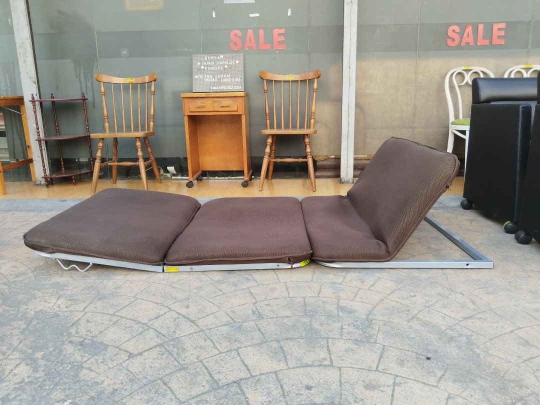 Brown Folding bed/Chair (Category: Chairs) located in Manila. Submitted by ivan_furnitures421 (Listing ID 1424902112, Image 2). Description: Brown folding floor chair is perfect for lounging. It can be adjusted to multiple positions. The chair has a metal frame and a brown fabric seat. It folds up for easy storage. Great for small spaces or extra seating..