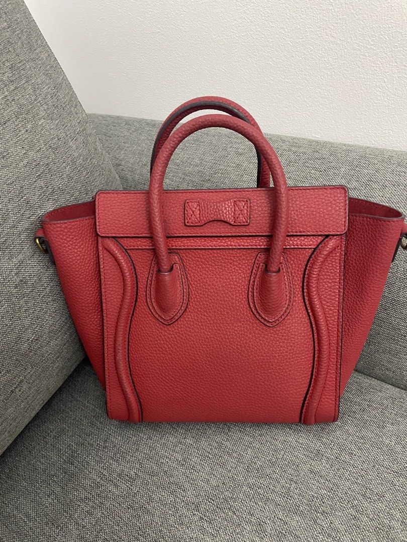 Celine Luggage Nano Handbag Red (Category: Luxury Bags & Wallets) located in Makati City. Submitted by chinyher (Listing ID 1425032997, Image 2). Description: Celine Luggage Nano handbag in red. Features a top handle, a front zipper pocket, and a spacious interior. The bag has the Celine Paris logo on the front. The interior includes a leather tag with the brand name. With sling.
