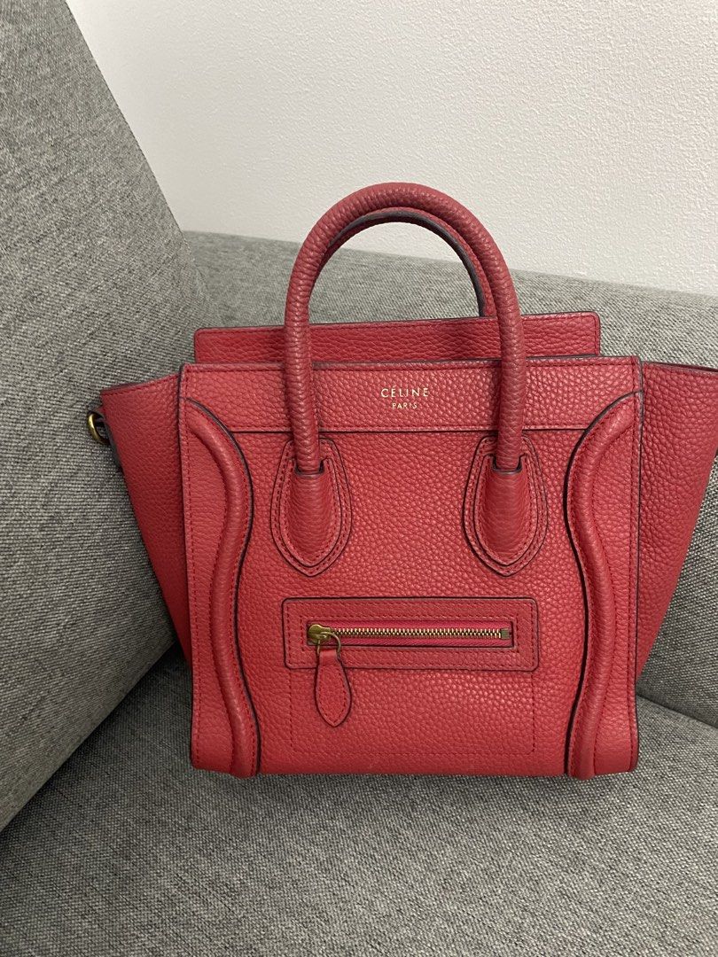 Celine Luggage Nano Handbag Red (Category: Luxury Bags & Wallets) located in Makati City. Submitted by chinyher (Listing ID 1425032997, Image 1). Description: Celine Luggage Nano handbag in red. Features a top handle, a front zipper pocket, and a spacious interior. The bag has the Celine Paris logo on the front. The interior includes a leather tag with the brand name. With sling.