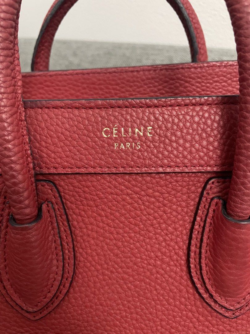 Celine Luggage Nano Handbag Red (Category: Luxury Bags & Wallets) located in Makati City. Submitted by chinyher (Listing ID 1425032997, Image 3). Description: Celine Luggage Nano handbag in red. Features a top handle, a front zipper pocket, and a spacious interior. The bag has the Celine Paris logo on the front. The interior includes a leather tag with the brand name. With sling.