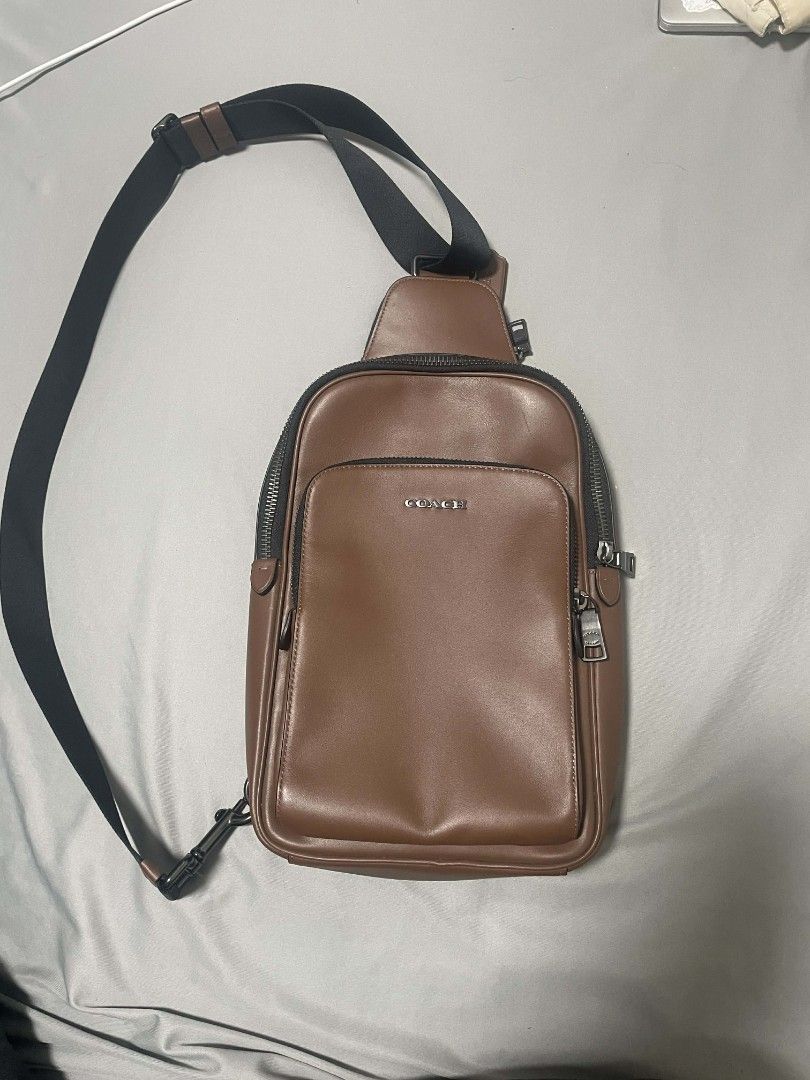 Coach Ethan Pack Sling Bag (Category: Sling Bags) located in Quezon City. Submitted by elkar (Listing ID 1424976810, Image 1). Description: authentic coach ethan pack sling bag in brown no flaws!! mint condition, just don't have the packaging na. recevied it as a gift a year ago but never used which is why i'm selling it now. this is from Coach Men's line but very classy on both girls & guys! perfect for a casual classy and clean look! dimensions