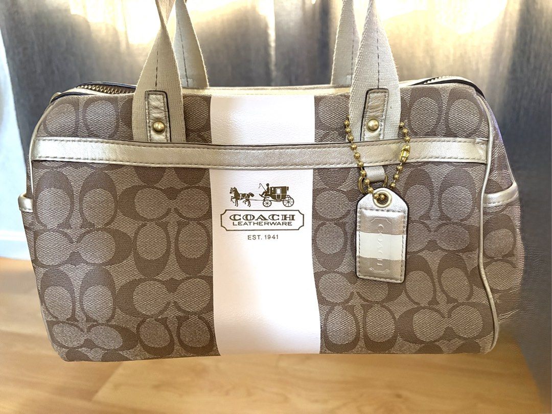 Coach Signature Handbag (Category: Luxury Bags & Wallets) located in Taytay. Submitted by tet_chamatris (Listing ID 1424936443, Image 1). Description: Coach New York Canvas & Leather mini Boston Bag. .