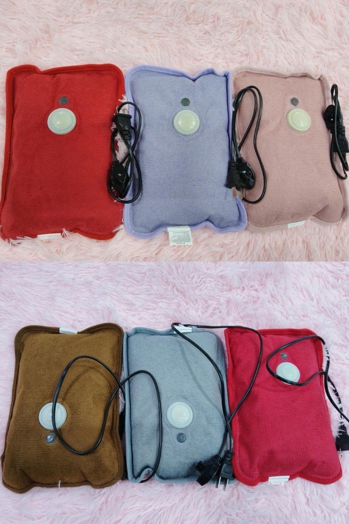 Electric Heating Pad - Various Colors (Category: Medical Supplies & Tools) located in Manila. Submitted by yzlshop (Listing ID 1424895798, Image 1). Description: Electric heating pads in various colors. Features a soft, plush exterior and a built-in power cord. Available in red, purple, pink, brown, gray, and maroon. Each pad has a circular button on the front. Provides soothing warmth for relaxation or pain relief. Easy to use and portable..