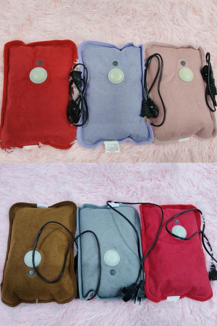 Electric Heating Pad - Various Colors (Category: Medical Supplies & Tools) located in Manila. Submitted by yzcartph (Listing ID 1424948473, Image 1). Description: Electric heating pads available in various colors. Each pad has a built-in power button and comes with a power cord. Colors include red, purple, pink, brown, gray, and a darker red. These pads are designed for heat therapy and relaxation. Perfect for soothing aches and pains..
