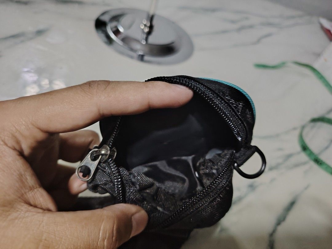 EXR Function Made Itself Bag (Category: Luxury Bags & Wallets) located in Manila. Submitted by drxx.drip_19 (Listing ID 1425034880, Image 2). Description: EXR bag features a black and teal design. It has a small, square pouch with the words "FUNCTION MADE ITSELF" printed on it. The bag has a zipper closure and a small loop. The bag also has a strap..