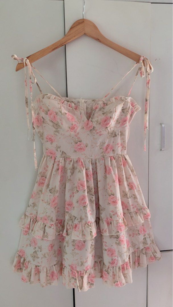 Floral pink Dress (Category: Dresses) located in Cavite. Submitted by mommyb3 (Listing ID 1424984595, Image 1). Description: Dress features a lovely floral print and a tiered ruffle design. It has tie straps and a sweetheart neckline. The dress is perfect for a casual day out or a special occasion. It is a mini dress with a flattering fit..