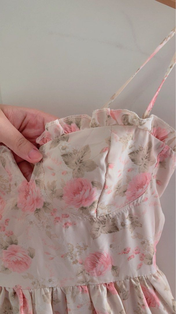 Floral pink Dress (Category: Dresses) located in Cavite. Submitted by mommyb3 (Listing ID 1424984595, Image 2). Description: Dress features a lovely floral print and a tiered ruffle design. It has tie straps and a sweetheart neckline. The dress is perfect for a casual day out or a special occasion. It is a mini dress with a flattering fit..