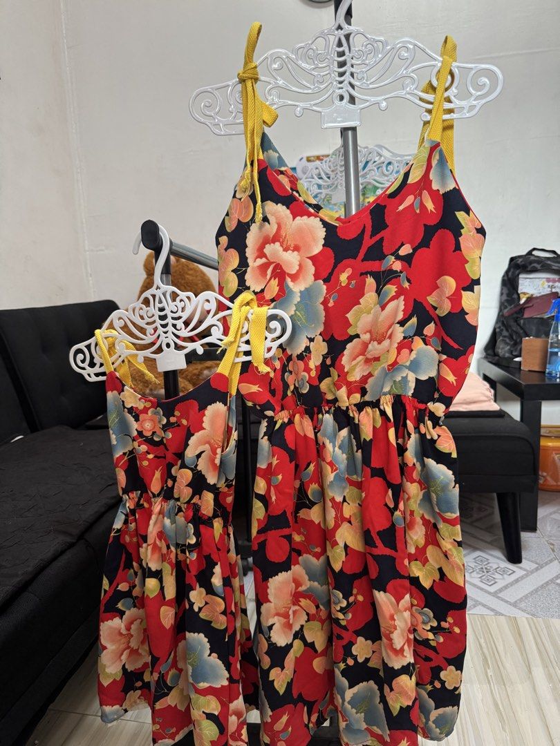 Floral Striped Dress Set (ph250/ Set) (Category: Dresses) located in Quezon City. Submitted by andreaeliz (Listing ID 1424887613, Image 2). Description: - Daughter size4-5y / Mother size M - Matching floral striped dresses - Spaghetti strap design - Cinched waist - White base with black vertical stripes and colorful floral patterns - Includes one child-sized and one adult-sized dress.