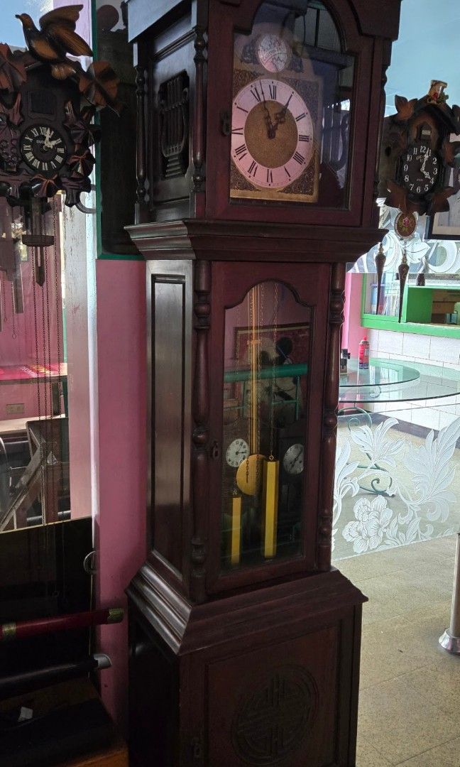 Grandfather clock (Category: Clocks) located in Caloocan City. Submitted by great_2003 (Listing ID 1163542861, Image 2). Description: good running condition maayos na maayos pa improvised weight made in germany chimes every 30 mins . issue .. nasa picture post na po.. konting chip lang sa kahoy 2 weight 86 H X 19.3 L X 12 inches approx. as is only wysiwyg.
