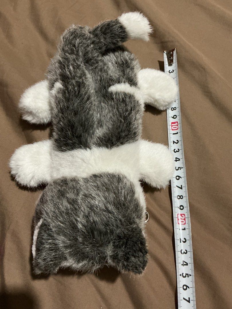 Husky Dog Plush Pouch (Category: Plushies & Soft Toys) located in Angeles City. Submitted by goodbuysathome (Listing ID 1425026983, Image 2). Description: Adorable husky dog plush pouch is perfect for storing small items. It features a zipper closure and a clip for easy attachment. The pouch is designed to look like a husky dog, with a black nose, blue eyes, and a fluffy white and gray fur. It is approximately 25cm long. Add sf 55 Gcash payment L