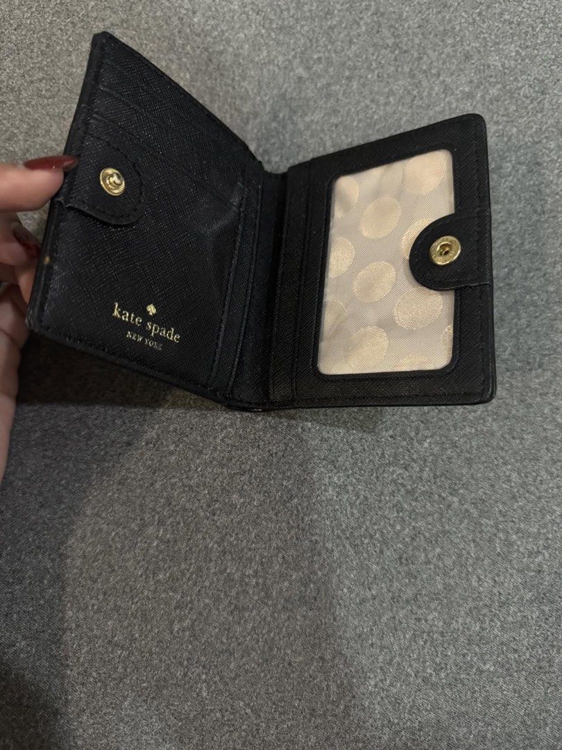 Kate Spade Black Bi-Fold Wallet (Category: Wallets & Card holders) located in Taguig. Submitted by hanamiyya (Listing ID 1424894742, Image 2). Description: original but with issues. dm me for more pics.