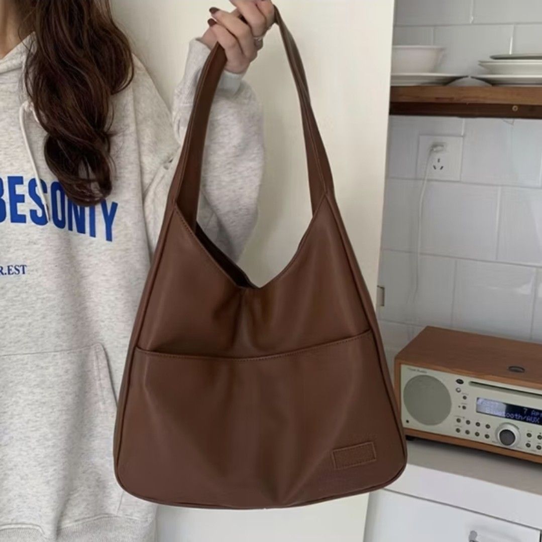 Leather tote bag Cream & Brown (Category: Shoulder Bags) located in Quezon City. Submitted by cgthreena (Listing ID 1424921657, Image 2). Description: Get 2 for only 200php. The brown one is free because of the defect in magnet closure. Please see photos for reference. .