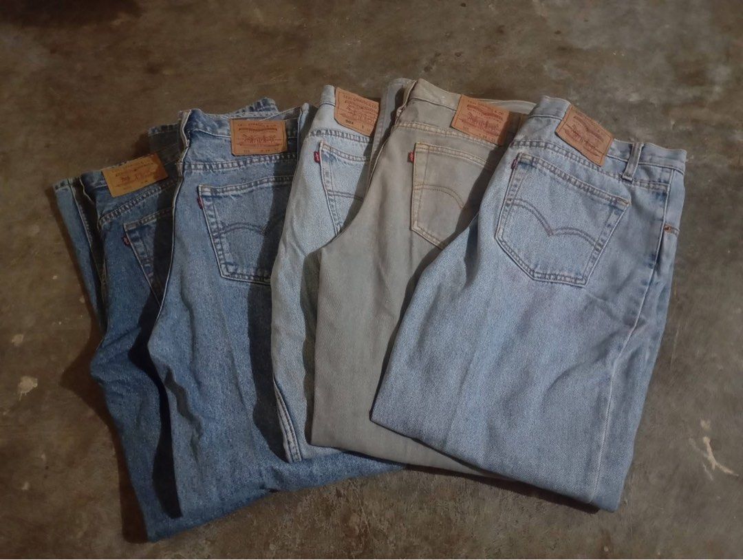 Levi's 505-502 Jeans - Assorted Colors (Category: Jeans) located in Manila. Submitted by rheinzpapi (Listing ID 1424932958, Image 1). Description: Collection of Levi's 505 - 502 jeans in various shades. Features the classic Levi's red tab and back pocket design. Includes light blue, medium blue, and grey denim. These jeans are a timeless wardrobe staple, perfect for everyday wear..