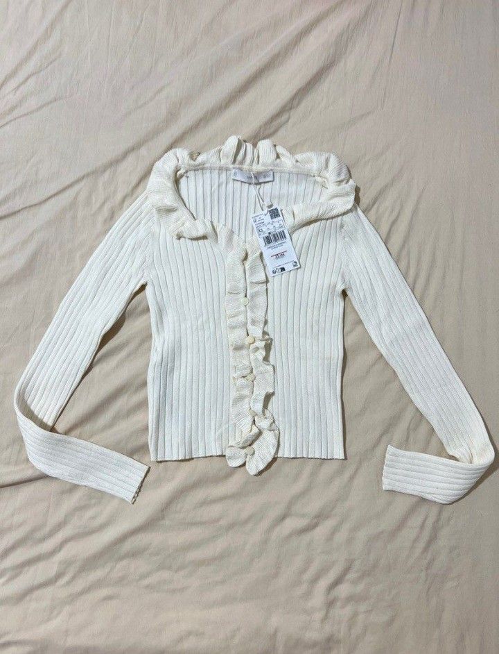Mango long sleeved cardigan with ruffles (Category: Blouses) located in Santa Rosa. Submitted by chaneloberli.n (Listing ID 1371853274, Image 2). Description: fake buttons brand new without tag (washed it) never used and don't see myself wearing this super pretty irl original price: 800+ on sale xs on tag xxs-xs 🌎 santa rosa city laguna 🤑 gotyme qr, maribank qr, bank transfer (landbank) 💌 j&t, lbc (no rush shipping), lalamove sometimes No gcas