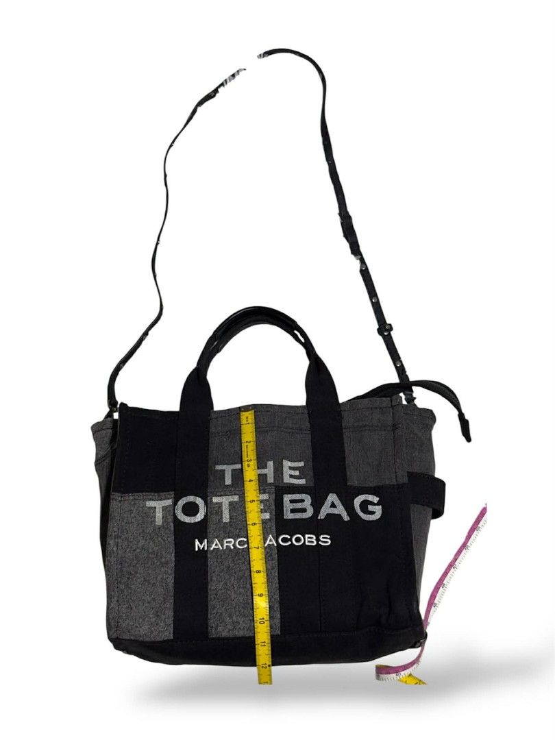 Marc Jacobs Patchwork Denim "The Tote Bag" (authentic) (Category: Luxury Bags & Wallets) located in Cebu City. Submitted by westleygics18 (Listing ID 1425049061, Image 3). Description: Marc Jacobs Patchwork Denim "The Tote Bag" (authentic) - Excellent Condition - Dual top handles reinforced with black leather grips for comfort and durability. - Strap: Includes a detachable and adjustable slim black leather crossbody strap with silver-tone hardwar